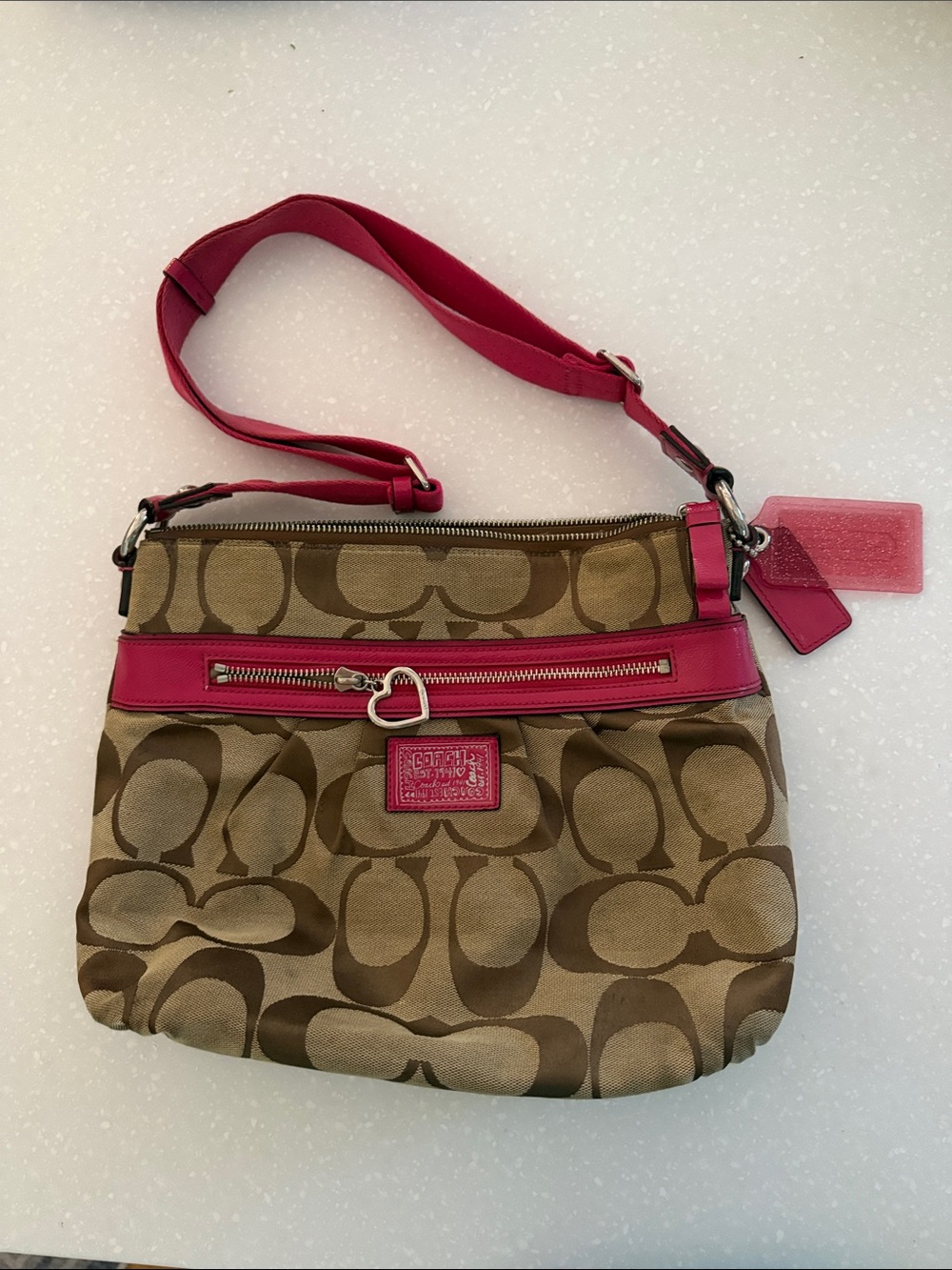 Coach Brown Signature Canvas Crossbody with Pink Trim and Heart Charm